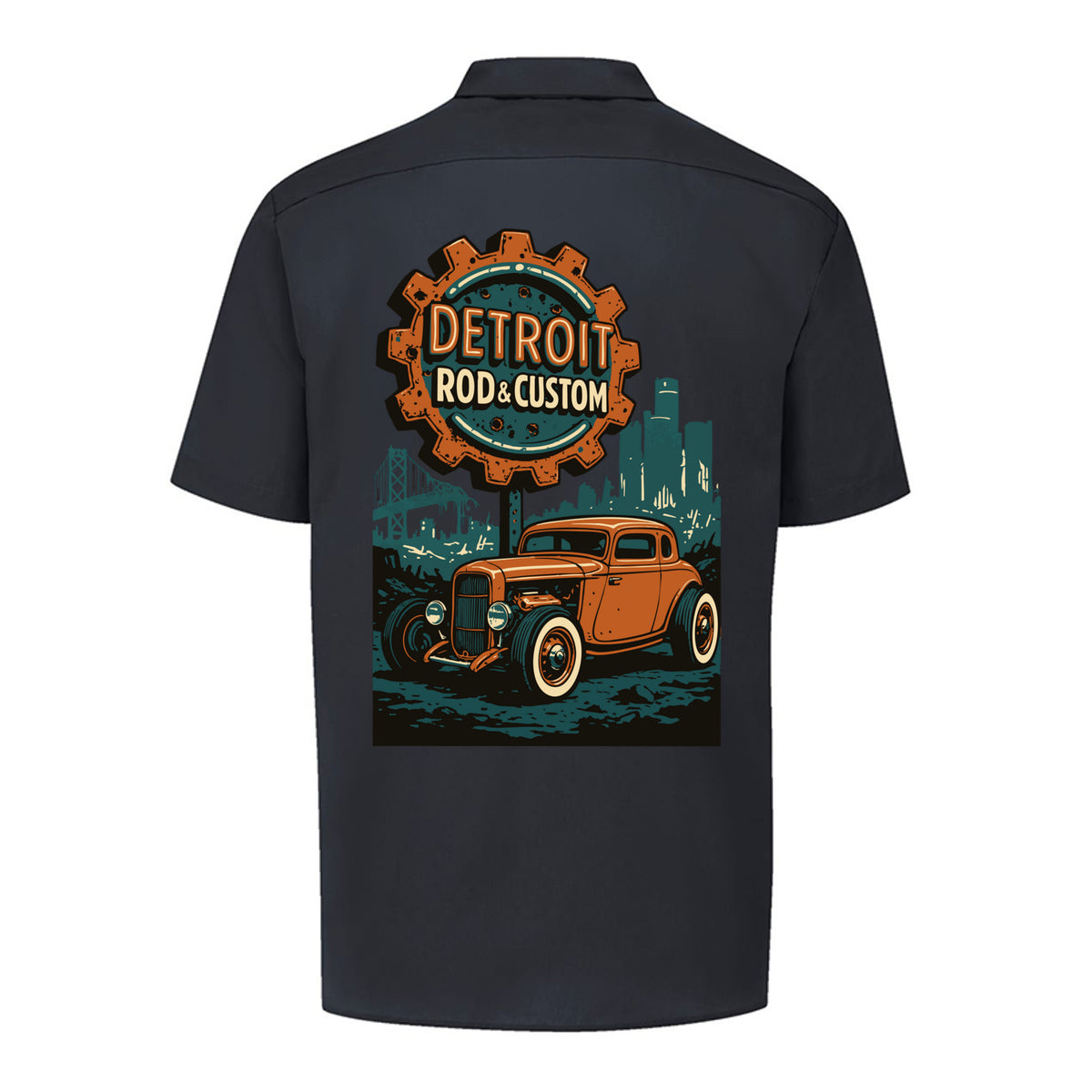 Back of a black Dickies short-sleeve work shirt with an orange Atomic Coupe hot rod under a DETROIT ROD & CUSTOM gear badge.