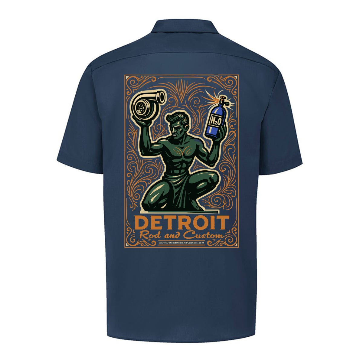 Back of a dark navy Dickies work shirt with a large print of the green kneeling statue holding a turbo and a bottle, over an orange DETROIT Rod and Custom panel.