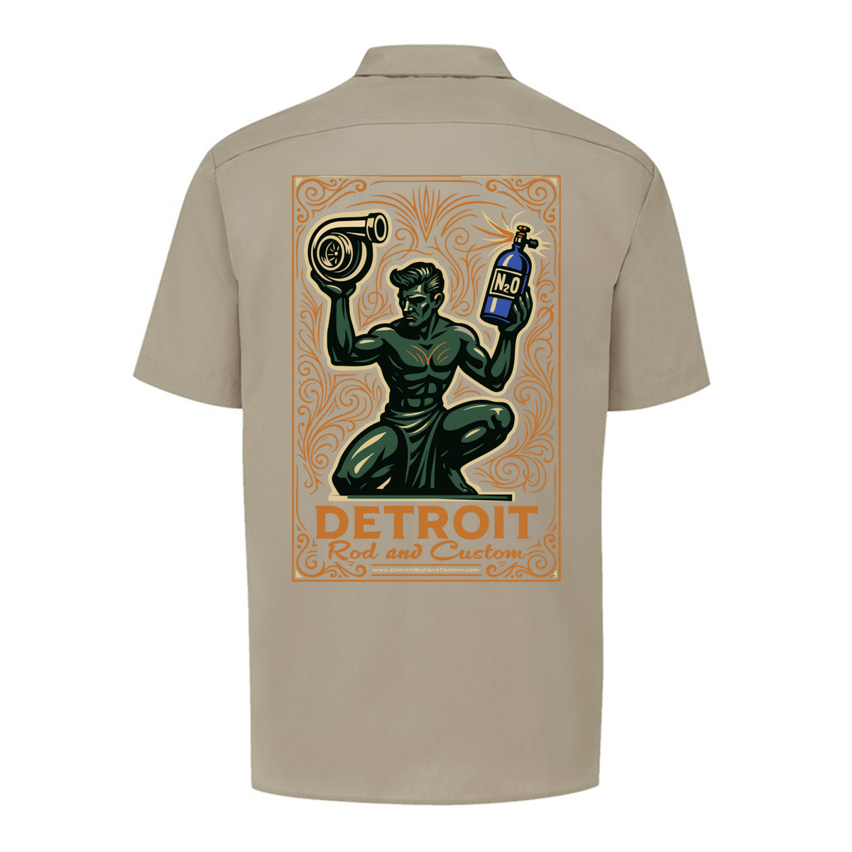 Back of a desert sand Dickies work shirt with a large print of the green kneeling statue holding a turbo and a bottle, over an orange DETROIT Rod and Custom panel.