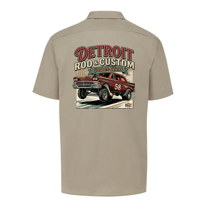 Back of a desert sand Dickies short-sleeve work shirt with a burgundy #58 Galaxie gasser launching nose-up under a red DETROIT ROD & CUSTOM banner.