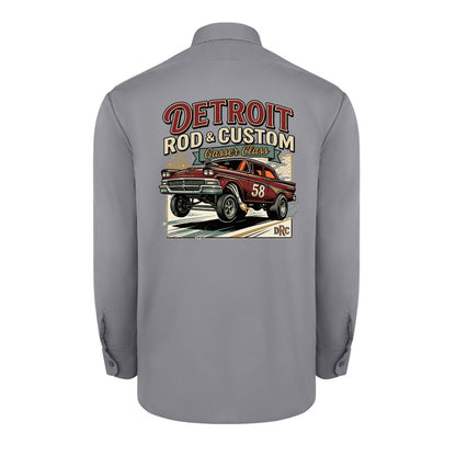 Back of a graphite grey Dickies long-sleeve work shirt with a burgundy #58 Galaxie gasser launching nose-up under a red DETROIT ROD & CUSTOM banner.