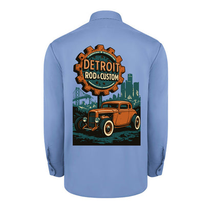 Back of a light blue Dickies long-sleeve work shirt with an orange Atomic Coupe hot rod under a DETROIT ROD & CUSTOM gear badge.