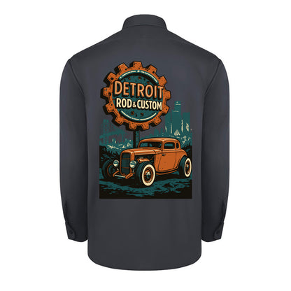 Back of a dark charcoal Dickies long-sleeve work shirt with an orange Atomic Coupe hot rod under a DETROIT ROD & CUSTOM gear badge.